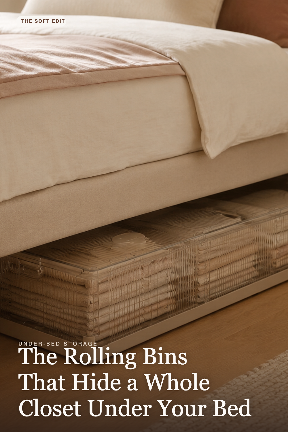 Clear rolling under-bed storage bin tucked beneath a bed with cream and blush linens